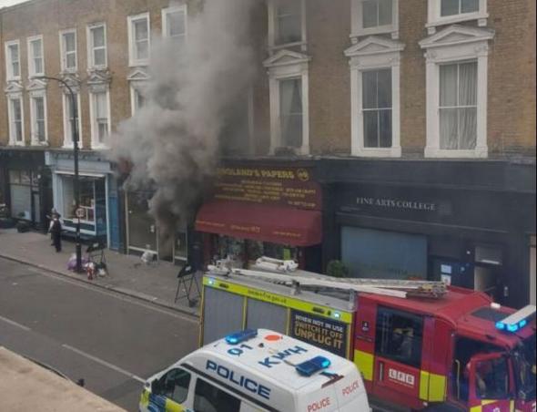 A commercial building on fire on a highstreet