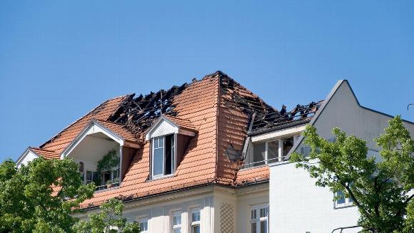 A house with fire damage to its roof